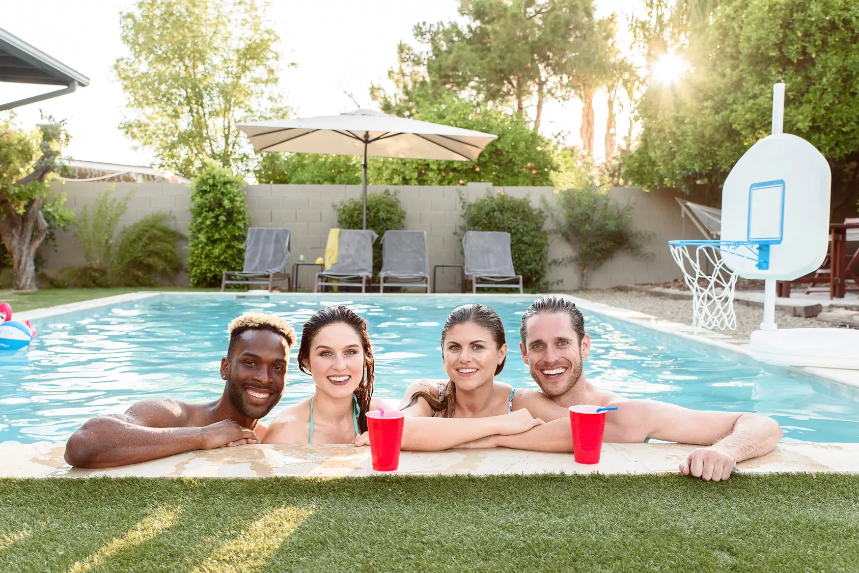 Portrait of smiling friends in swimming pool, 25-29 years, 30-34 years, 35-39 years, african-american ethnicity, Scottsdale Arizona. Stay Hydrated, Mobile IV Hydration, IV Hydration,